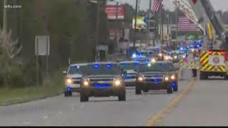 Procession brings fallen officer home