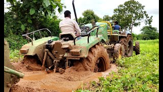 John Deere 5045D tractor stuck in deep mud Rescued by new holland 4710 tractor