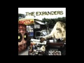 The expanders  world of happiness hq