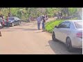 Black River residents look on after vehicle falls off the Lacovia Bridge
