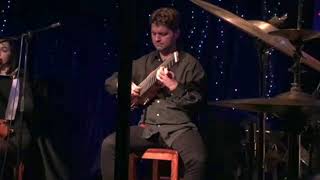 8 string Moov Travel Guitar in concert