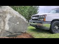 Pulling out a huge rock with my truck