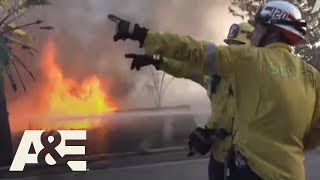 Members of the san bernardino county fire department courageously
battle a wildfire that spread over 17 acres on monday, october 21,
2019. firefighters evacu...