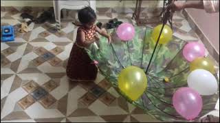 poping umbrella balloons