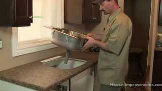 Shannon from http://www.house-improvements.com/kitchen shows you how to cut the countertop to prepare for and install a 