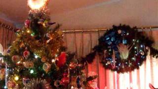 Rotating 1970s style Christmas tree with spinning light tree topper