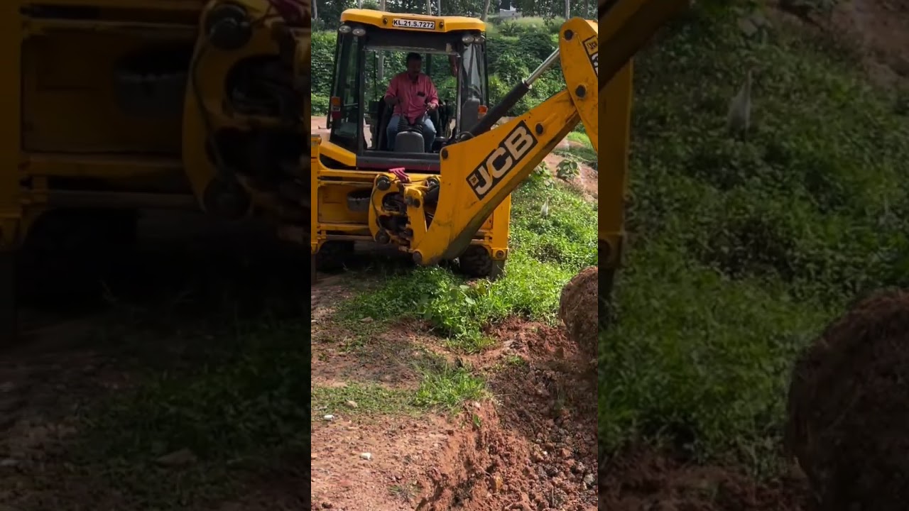Jcb 3dx digging and removing plant waste from canal 
