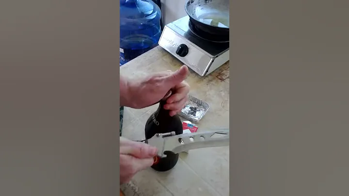 Open a bottle with knife.