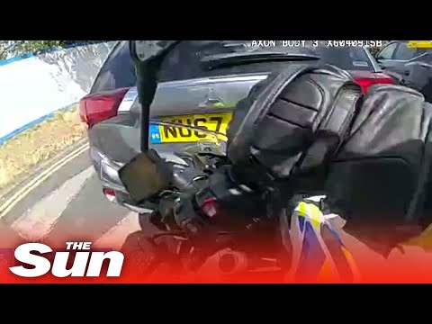 Raging driver RAMS police officer off his motorbike in horror hit and run.