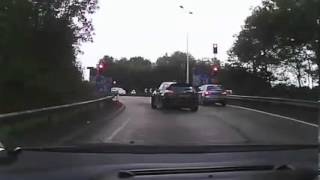 Black Nissan Juke - M4 J33 - Red Light