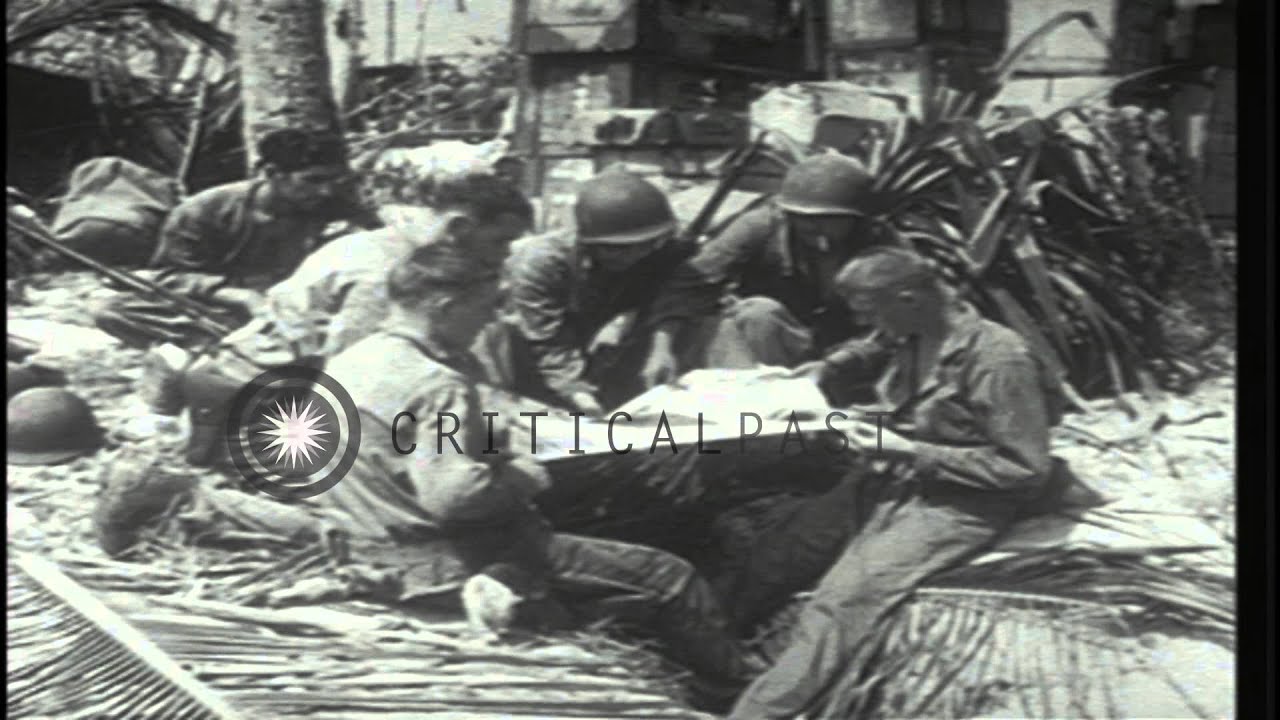 US Marines unfold a Japanese flag on Gilbert Island, Kiribati during Pacific Camp...HD Stock Footage