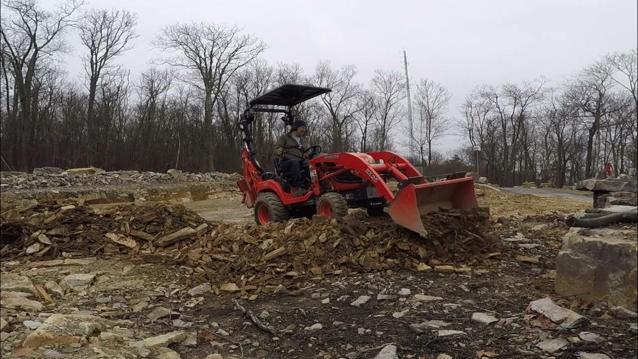 Excavating Shale and spreading it with a Bx25 - YouTube