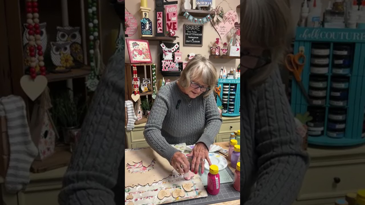 Painting a Snoopy Christmas wreath into a Valentine decoration.  