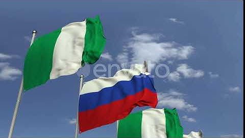 Flags of Nigeria and Russia Against Blue Sky | Motion Graphics - Envato elements