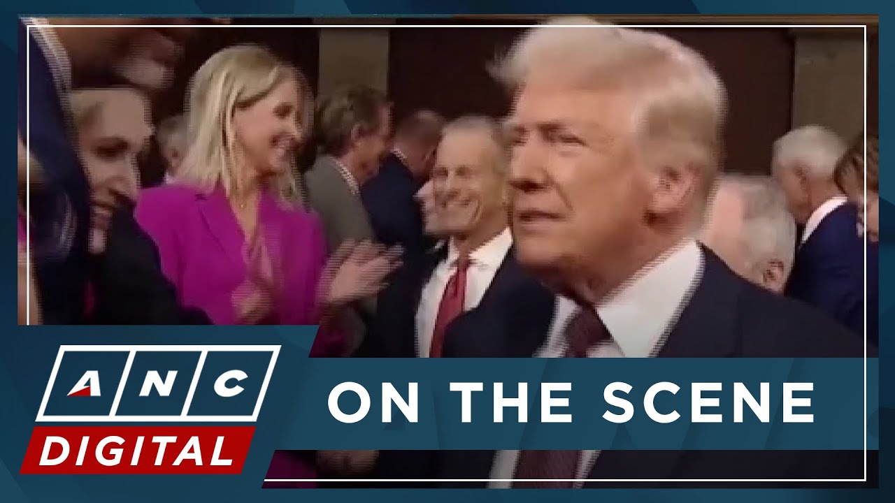 MOMENT: 'This is not normal' protest sign yanked away as Trump arrives ...