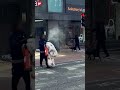 🚨 Terrifying moment man armed with fire extinguisher sprays people walking by 🧯