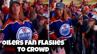 Edmonton Oilers fan flashes crowd During game