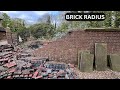 Massive brick radius wall repair on 19th century wall  tree damage bricklaying construction