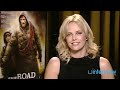 Charlize theron on working with unshowered viggo mortensen on the road