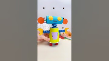 Dansende robot met papieren beker en gekleurd papier #OuderKindKnutsel #HandgemaaktDIY #Zelfgemaa...