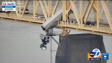 Harrowing video shows truck dangling over Ohio River after crash on bridge