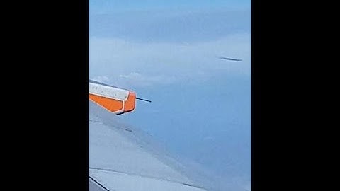 Passenger on a plane films a strange object moving through the sky