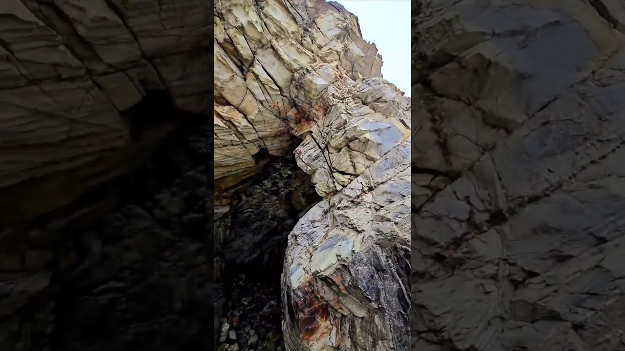mine cart emerges from cliff in Cornwall. 