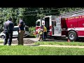 Firefighters getting turnout gear off