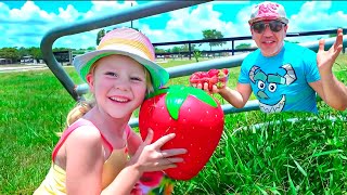 Nastya and dad feed farm animals and collect fruits and vegetables