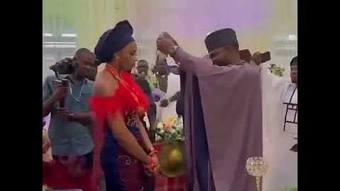 Bride refuses to smile as her husband sprays her Naira notes at their traditional wedding