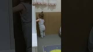 Curious 16-Month-Old Exploring Her Toys