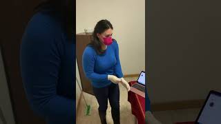 Cleaning the kitchen in tight latex gloves and leather boots