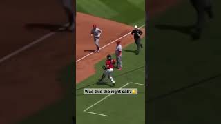 Umpire calls runner out after an error?! #viral #baseball #mlb #views #shorts