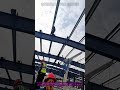 Steel Frame Construction: Worker Assembling Load-Bearing Frame#SteelFrameConstruction