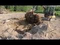 Removing large tree stump with John Deere 35G