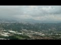 COCKPIT VIEW OF LANDING AT SAN JOSE COSTA RICA AIRPORT CIRCLING RWY 25