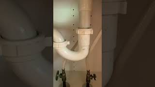 Fixing a clogged sink drain, cleaning out a P trap.