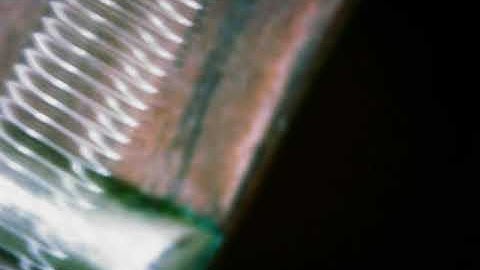 Vibrating guitar string under USB microscope