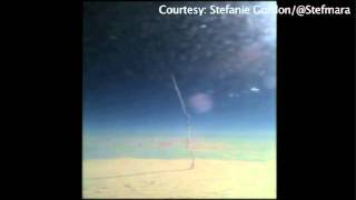 Shuttle launch seen from plane window