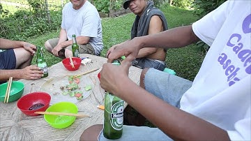 Vietnamese neighbors show how to open a beer bottle with just about anything.