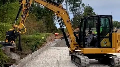 Cothren’s Custom Hardscapes and their CAT 306 with Engcon’s Tiltrotator System in action.