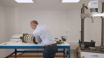 Connecting an extension topcap to a loadcell in a triaxial cell.