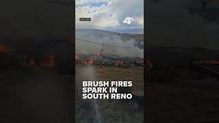 Reno homeowner sprays down yard as brush fires break out nearby