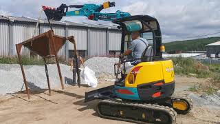 Kubota RX 306 насыпание сыпучих материалов