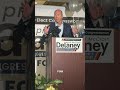 John Delaney addresses the crowd at his wife, April McClain Delaney’s watch party