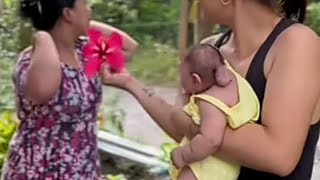 she is so sweet wearing baby lily gemoy flowers