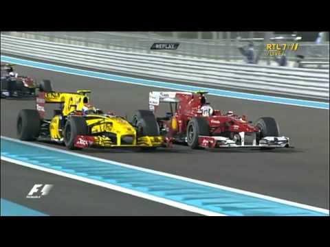 Alonso waving Petrov in Abu Dhabi 2010