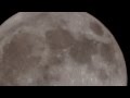 ISS crossing the full moon in the center