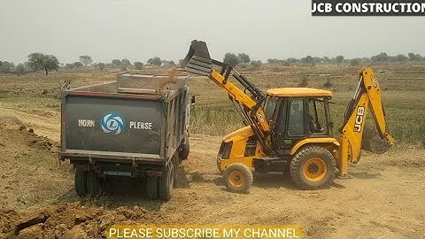 JCB Backhoe Loader Cutting Mud and Loading in Dump Truck - JCB Backhoe Machine at Work