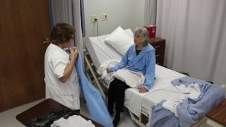 Undressing and dressing a resident